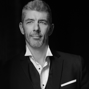 A headshot of Kyle Derek